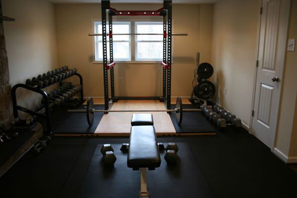 Fully equipped Oly gym with dumbbells, platform, and plenty of space